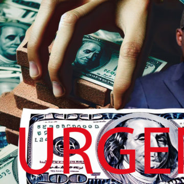 main-sur-dollars-us Main sur liasses de dollars